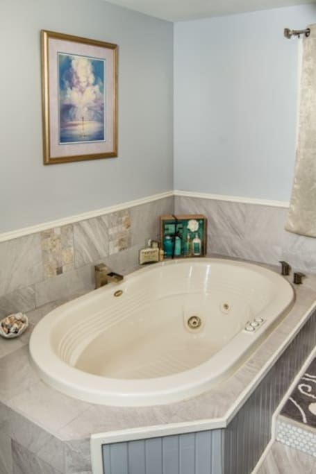 Large jetted tub in master bathroom.