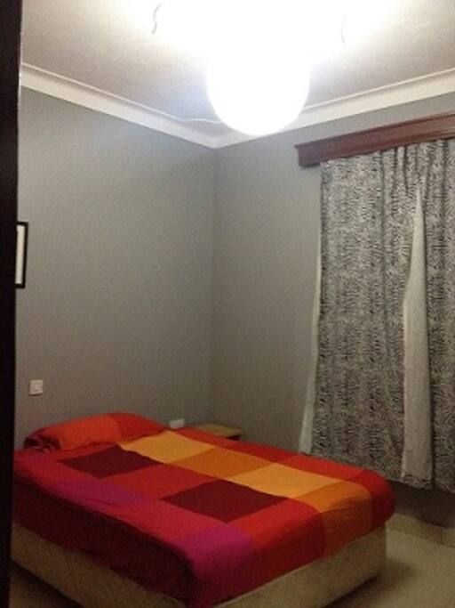 Double bed with comfy spring mattress and good lighting