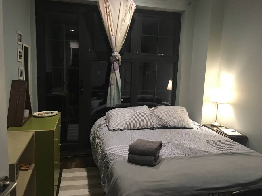 Available bedroom with queen bed, great natural light in the morning and door to access balcony.