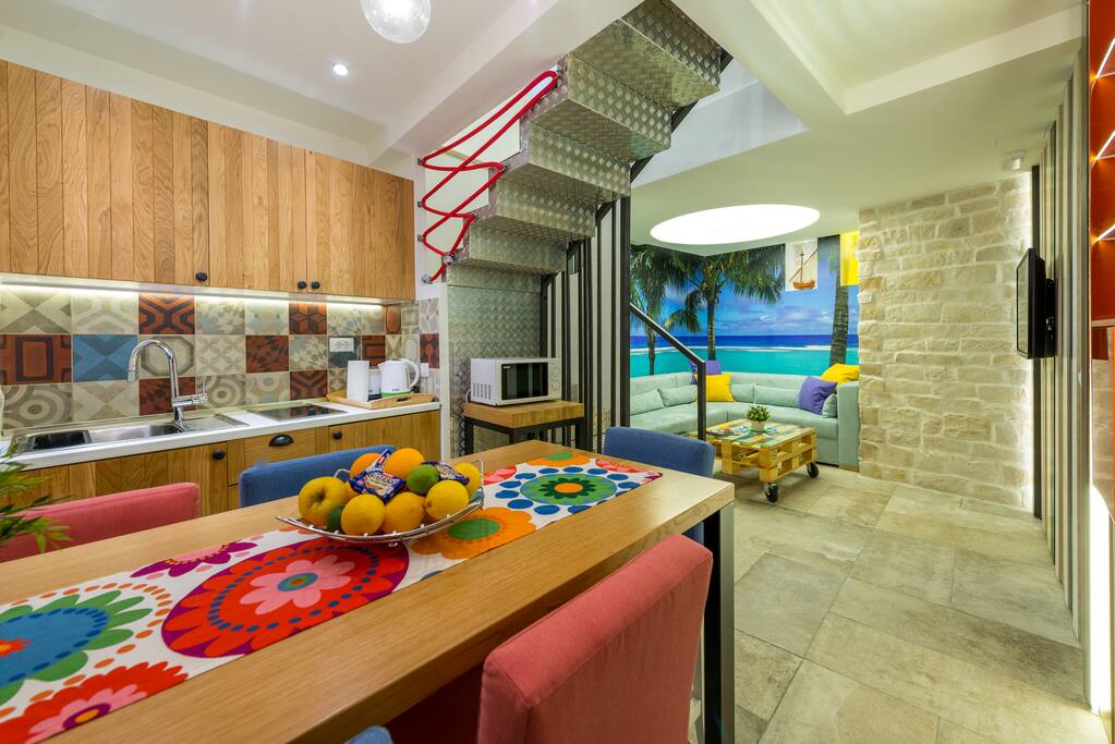 Kitchen with dining place and living room