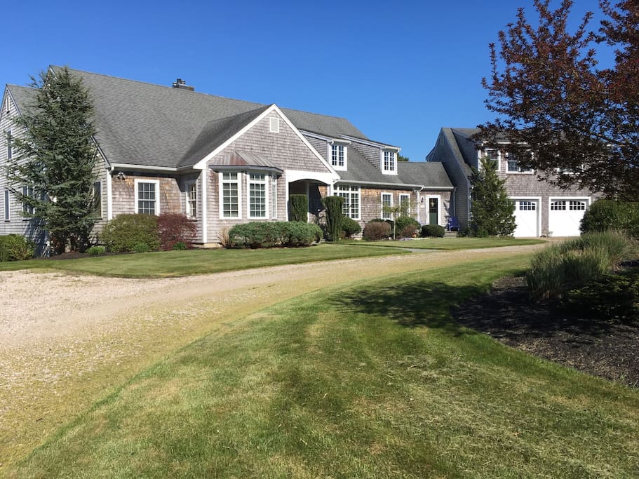 Classic cape style; apartment sits above the 2-door garage.