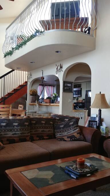 From living room facing kitchen. Bedroom loft above.