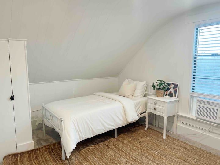 Here’s where the past meets the present. The third bedroom remains true to the home’s minimalist style while still nodding to icons past.
