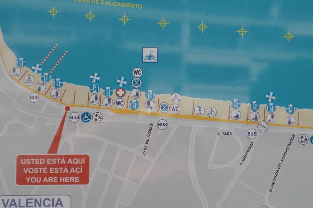 Playa Muchavista sign. It is part of a 7.8 km long white sanded beach.