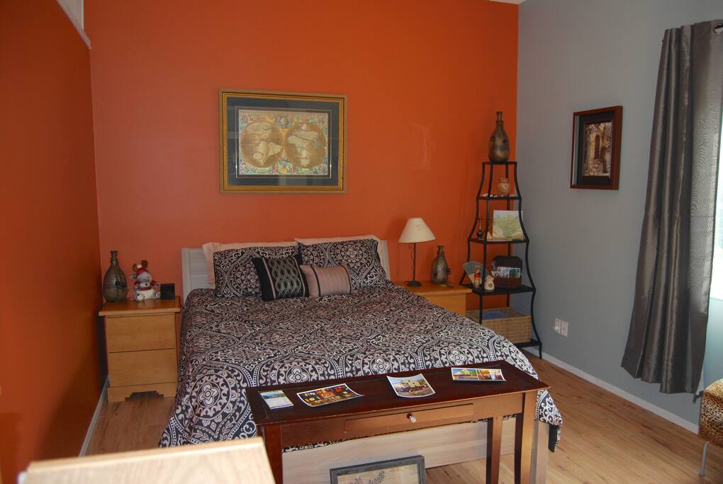 Queen size bed, new bedding, ceiling fan