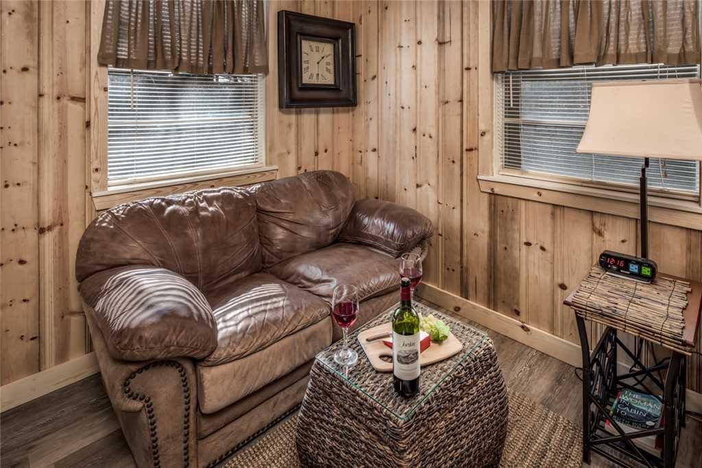 An sitting area in this studio cabin is perfect for catching up on a book or resting in between meals!
