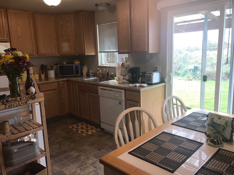 Kitchen is cozy and stocked with locally roasted coffee. Backyard is secluded and quiet.