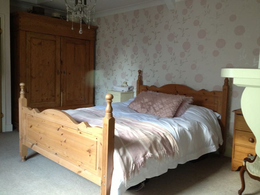 Main bedroom, with access to main bathroom and to adjourning room with toilet & sink.