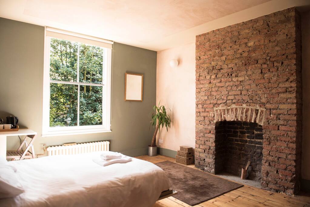 Exposed original fireplace.