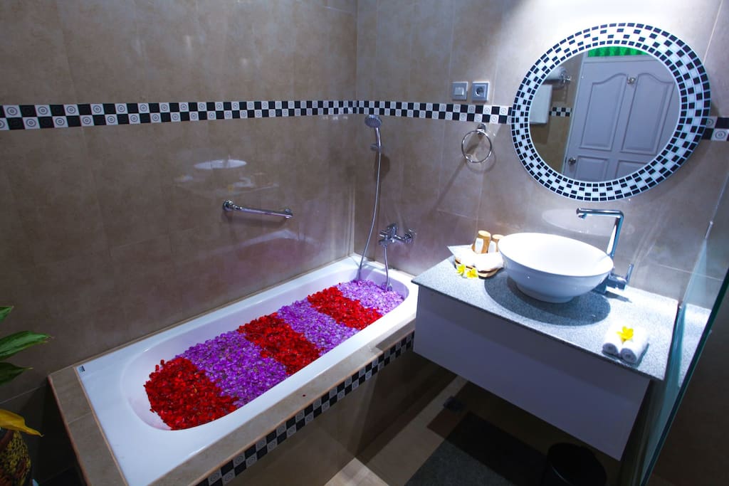 Bathtub in the clean and fresh bathroom.