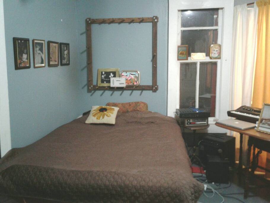 Bedroom located in the back of the house has the adjoining bathroom attached via a curtain wall. More private than it sounds. This listing only has one bathroom and it is shared between all of the guests.