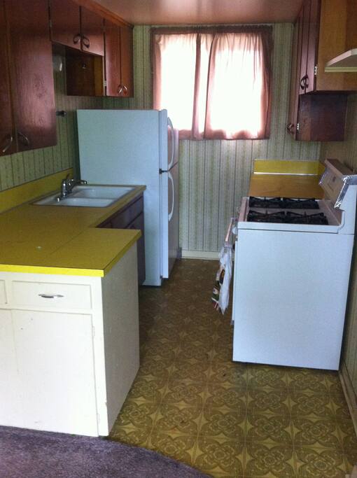 Kitchen - full sized gas stove and full size frig