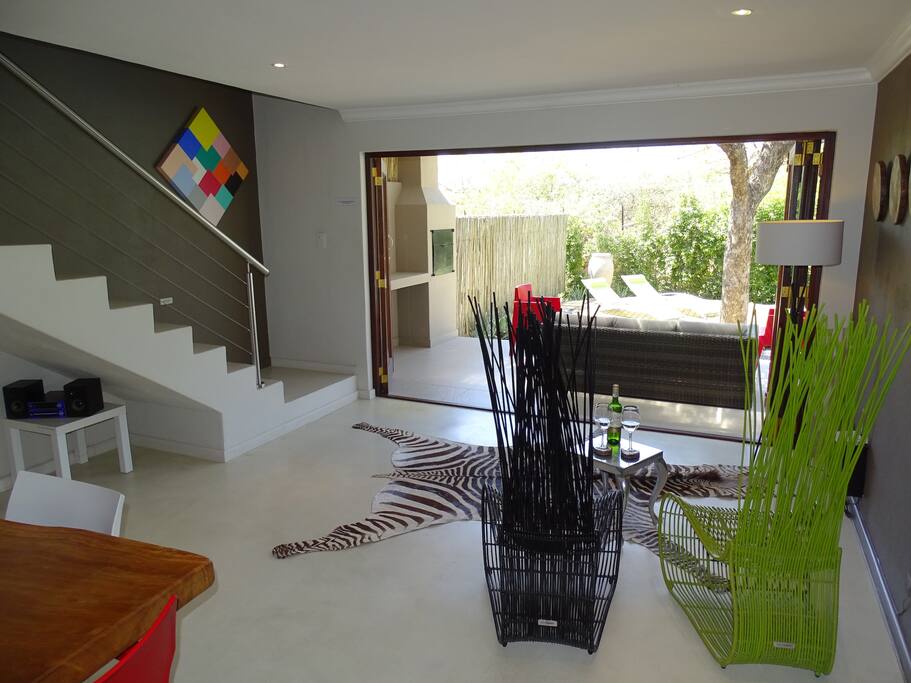 Downstairs lounge, stack away doors opening onto the garden