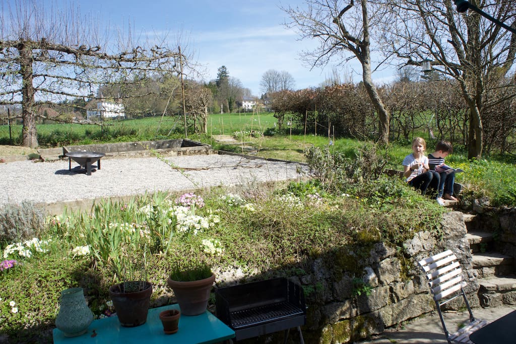 rear garden with fireplace and huge trampoline (not shown here)