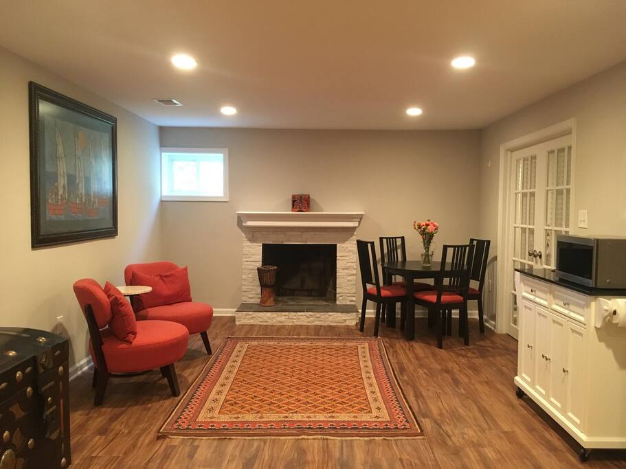 Living space, sitting area, dining chairs and modest kitchenette