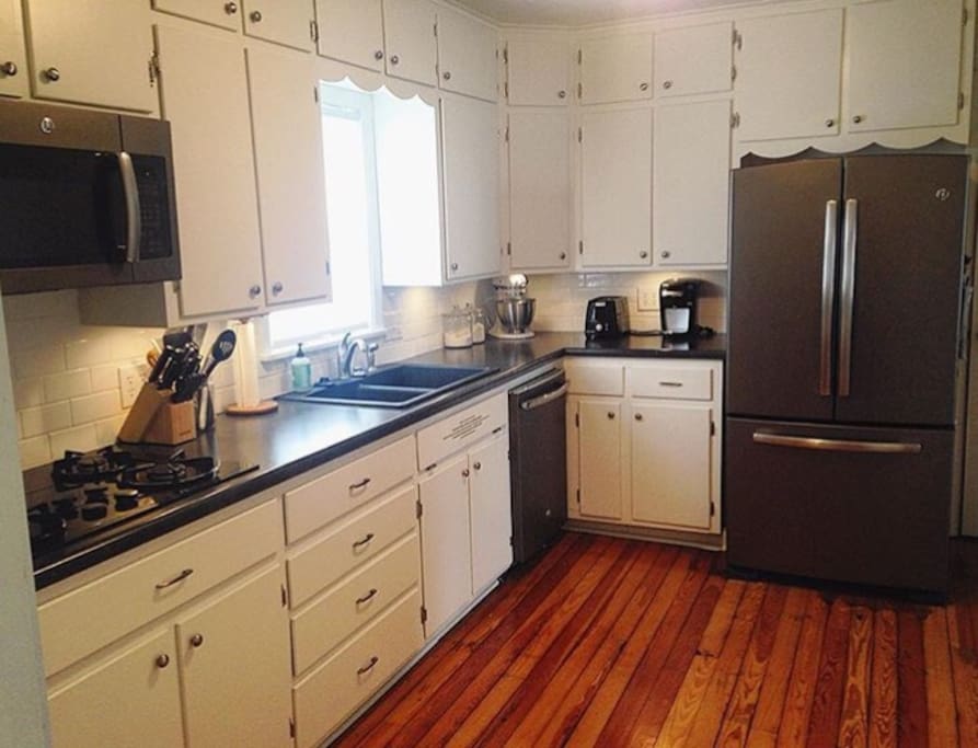 Full kitchen with gas stove, oven, dishwasher & refrigerator.