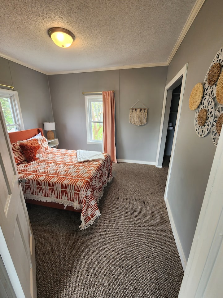 Bigger of the bedrooms, equipped with a queen size bed. Closet area, dresser and small TV included in this room.