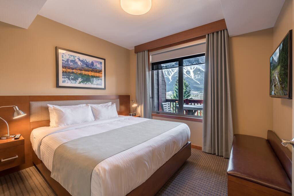 Relax and watch TV in bed after a fun day on the town.