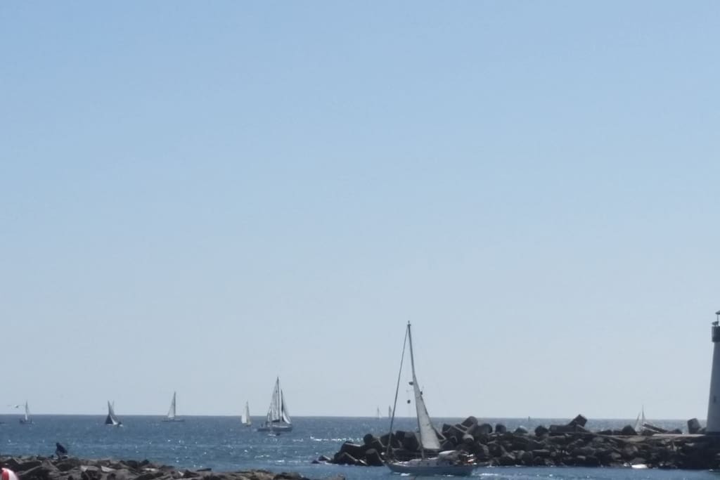 Harbor entrance, walk to the lighthouse and to the tip of the jetty .
