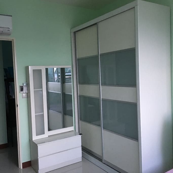 Room with cupboard, dressing table and aircon