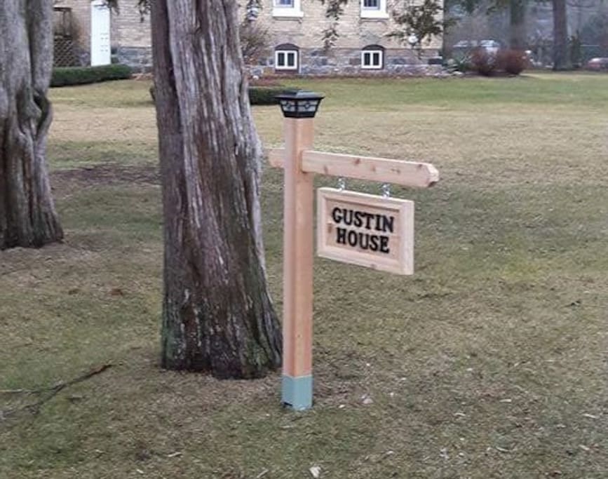 The Gustin House sign at the end of the driveway