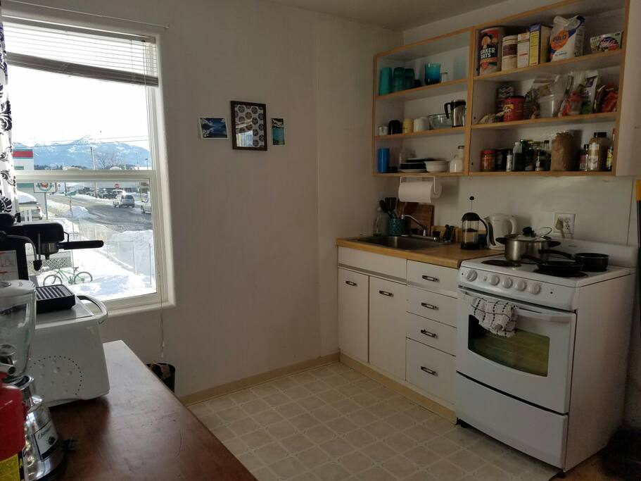 Kitchen, armed with spices, oil, some staples, and a nice mountain & ocean view!