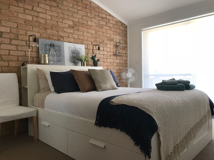 Queen size bedroom with built in robe and private balcony