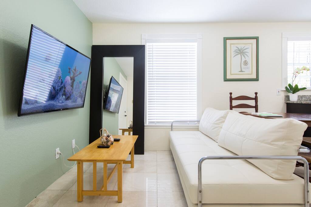 Beautifully decorated Living Room and Dining Room with 55 inch TV