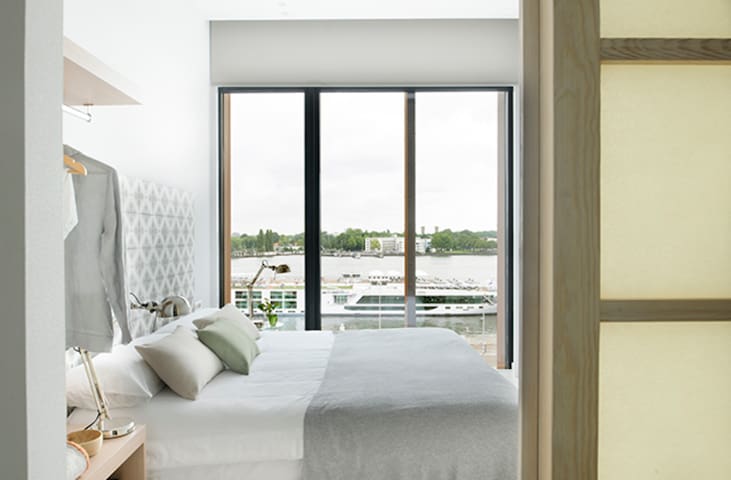 Bright Nordic-Designed Apartment with River View