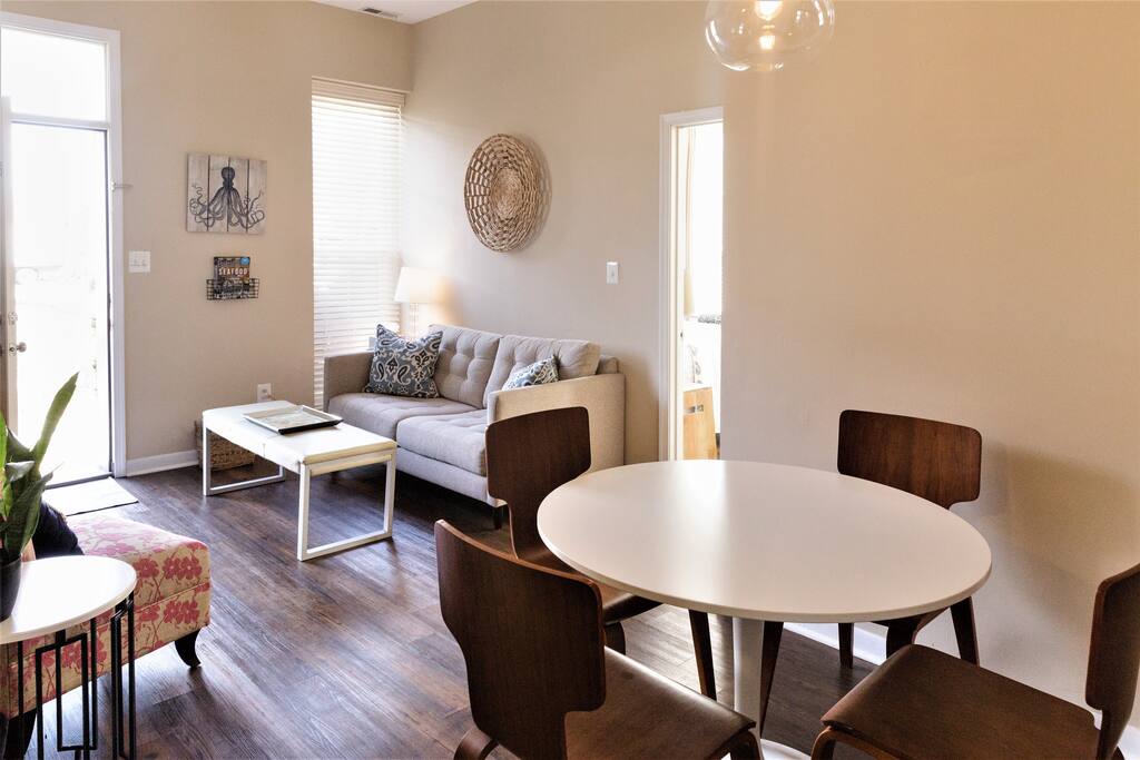 Living Room with Sofa, Sitting Chair, Coffee Table and Flat Screen T.V. with Cable Access.