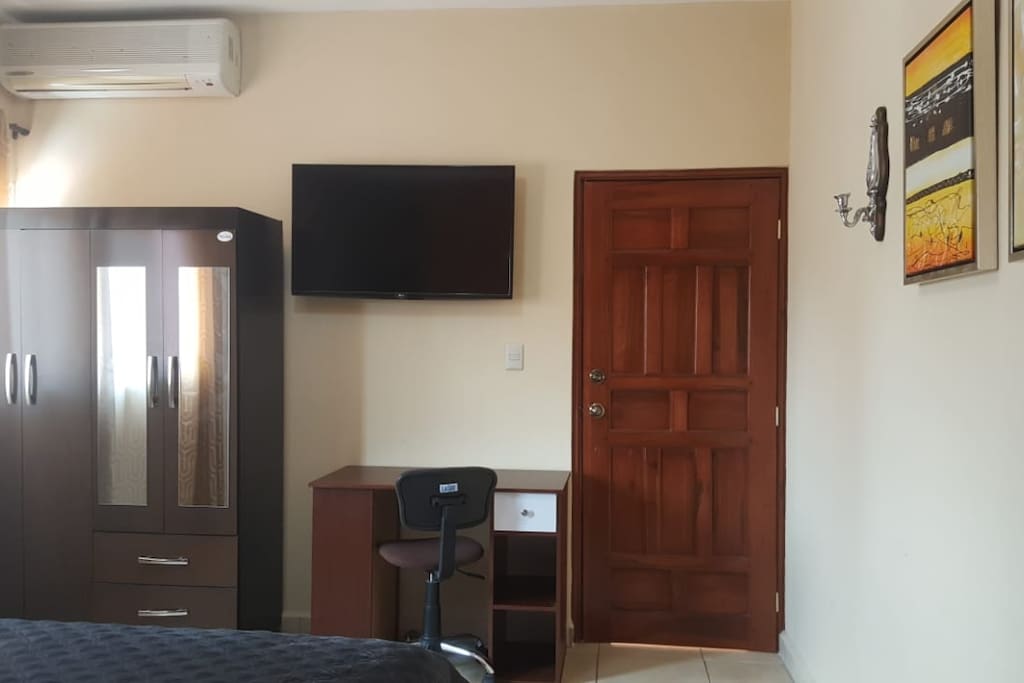 Room contains desk, wardrobe, Cable TV, Air Conditioner, Desk, and Complimentary Wi-Fi