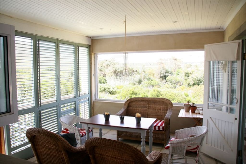 Our lovely stoep can be opened right up in good weather or closed in on windier days.