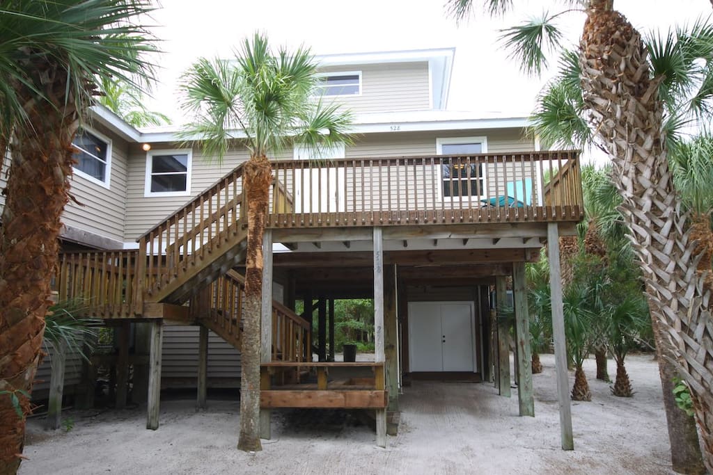 Secluded in Palms and Coconut trees Front view second floor entrance