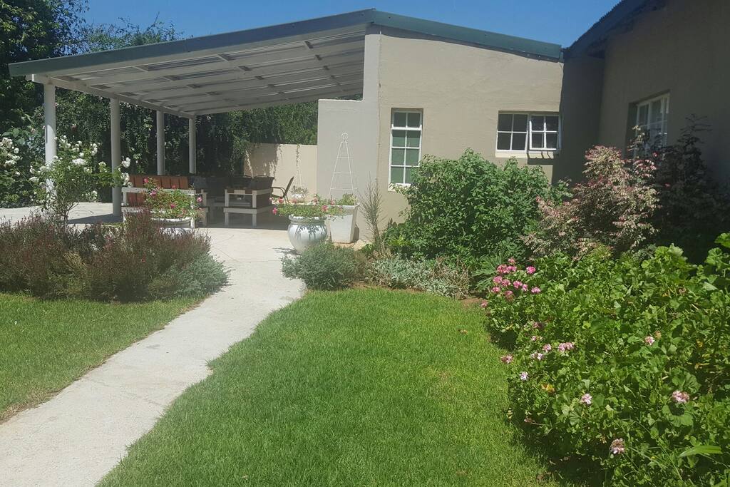 Walkway onto your spacious private patio with braai/barbeque