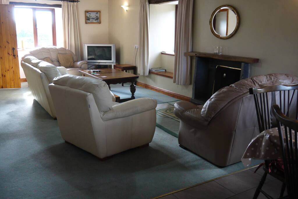 Spacious lounge with comfortable leather seating