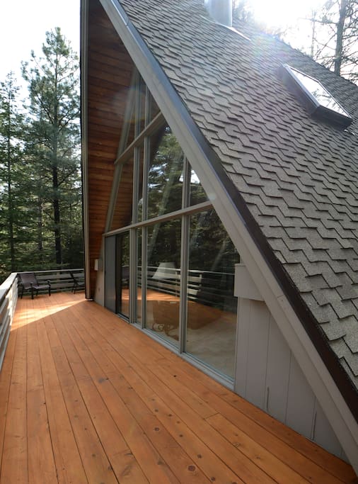 wrap-around deck set amidst the trees and birds