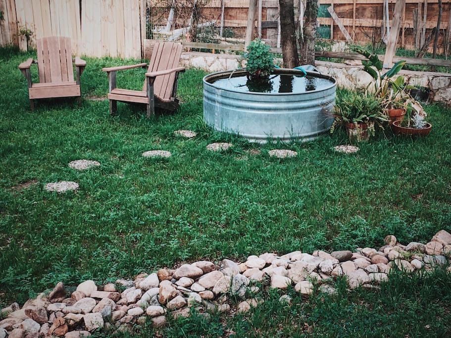 Beautiful back yard for lounging and listening to the trickling pond