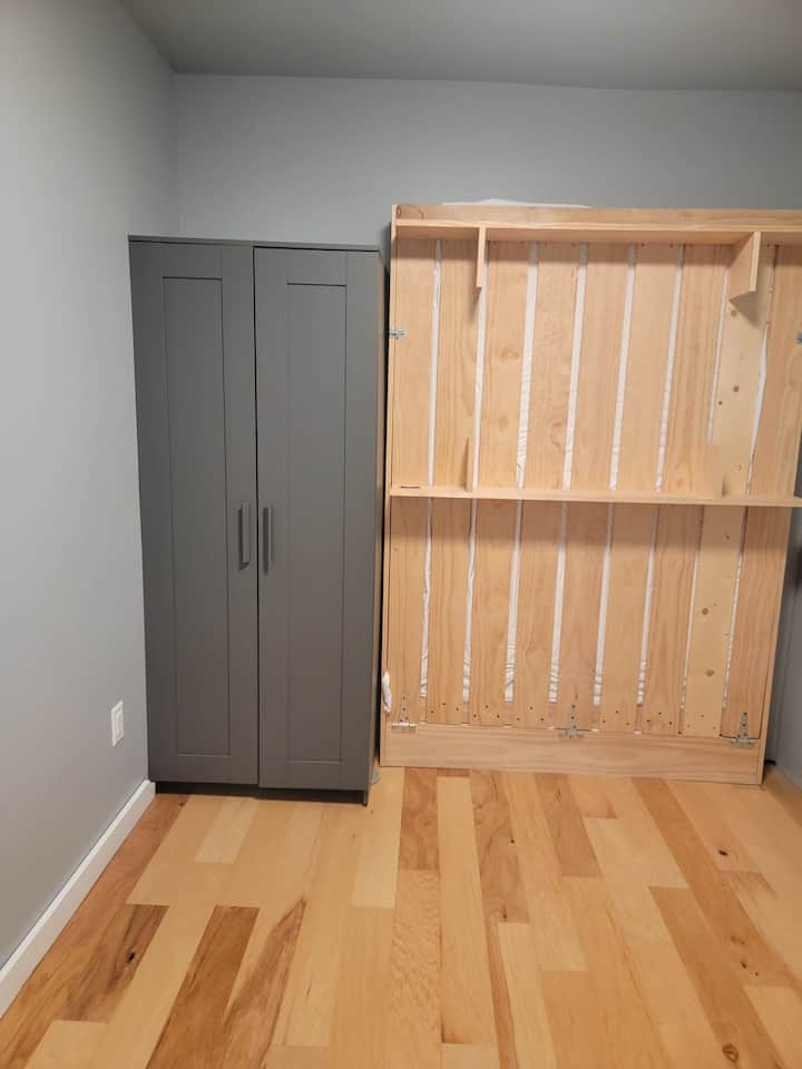 Small bedroom with queen Murphy bed