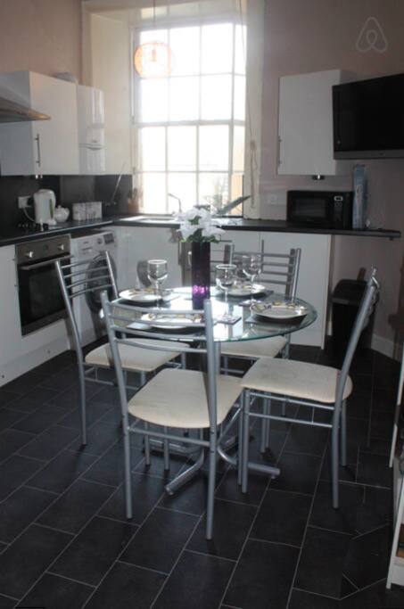Kitchen with TV (and 2 seater sofa)