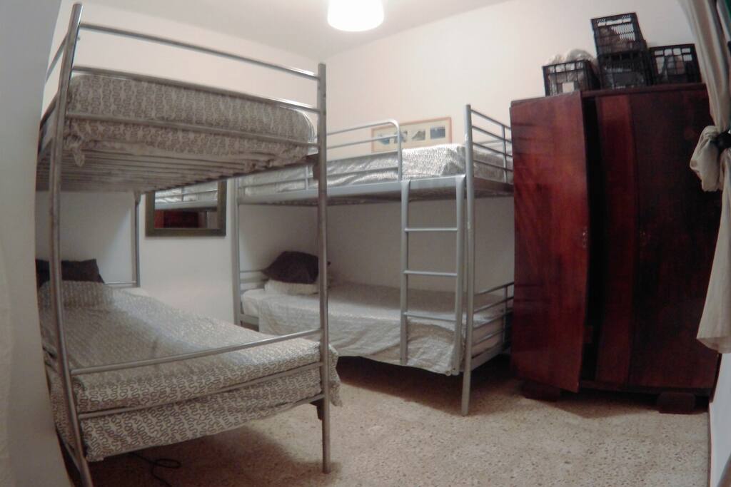 CLEAN SHARED ROOM FOR 4 IN FRIENDLY SURFHOUSE NEXT TO FAMARA BEACH, BUS STOP, MARQUETS, BARS, RESTAURANTS AND SHOPS...