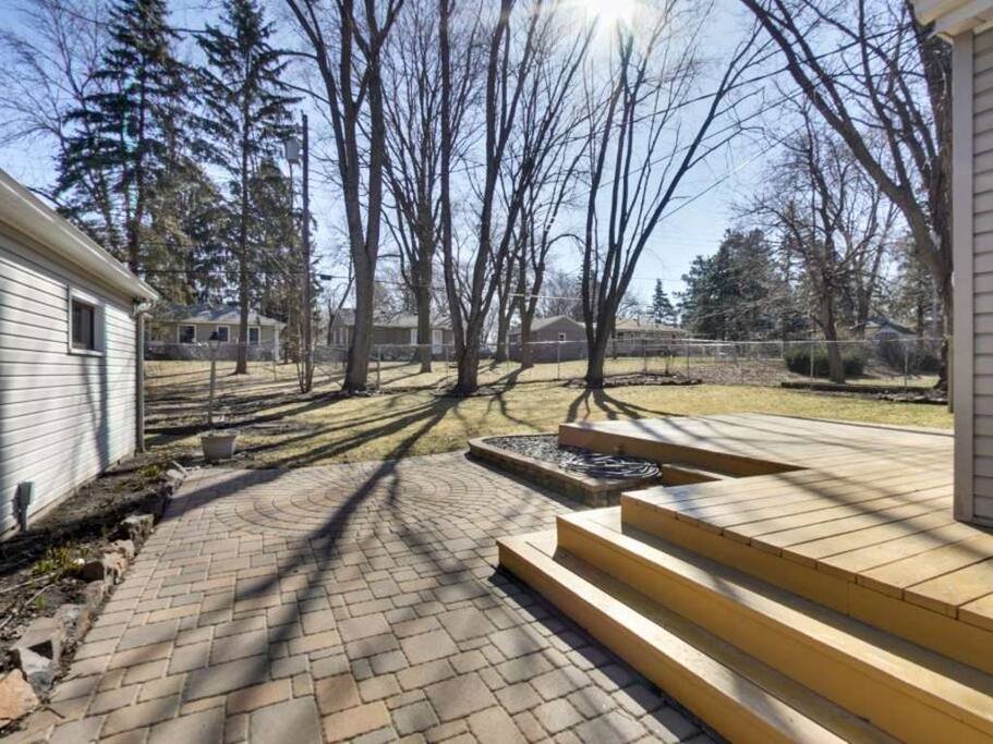 Big backyard with a deck and gas grill