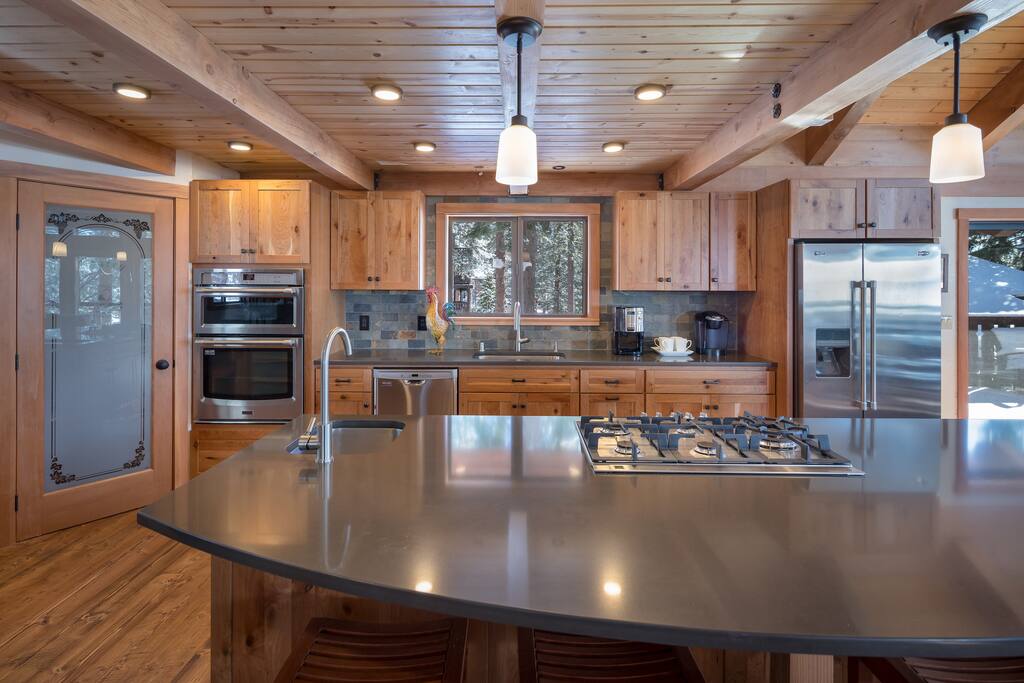 Cooking for a large family or gathering of friends is a breeze in this open kitchen, with large island that seats 8, dining area that seats 8, all new appliances, gas cooktop, prep sink and large walk-in pantry. The kitchen also has a workspace nook tucked away for those who would like to use their computer at a desk.