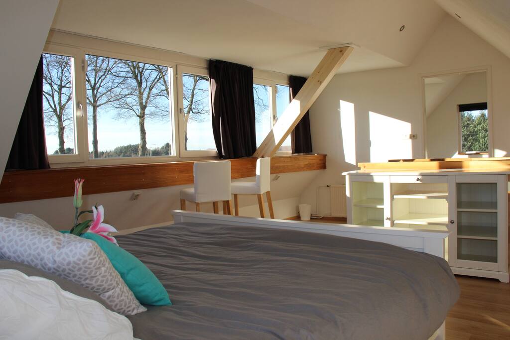 Main bedroom upstairs with breathtaking sunsets & sunrises!