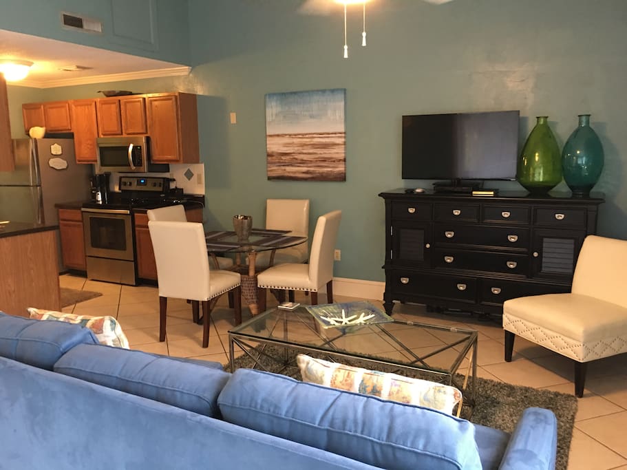 Kitchen, living room , sleeper sofa and flat screen smart TV.