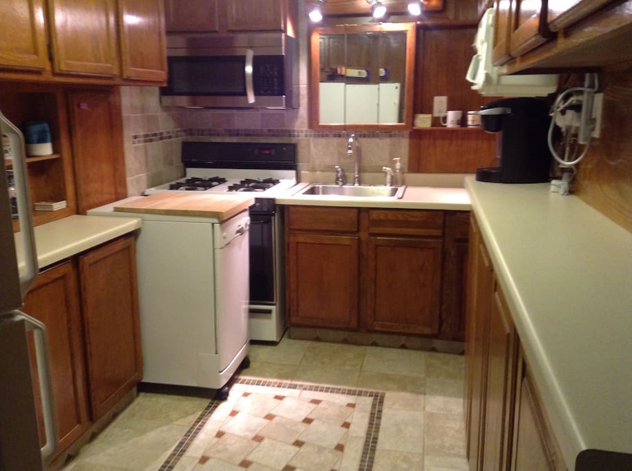 Private kitchen stocked with silverware, dishes, and appliances for you to use during your stay!