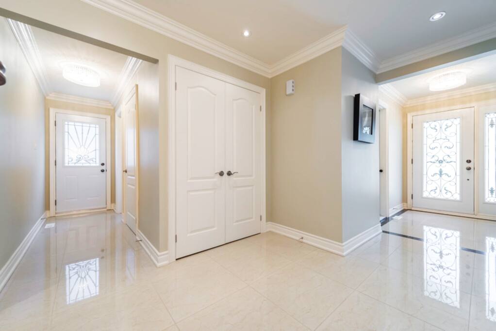 Front entrance. Marble floors and natural light