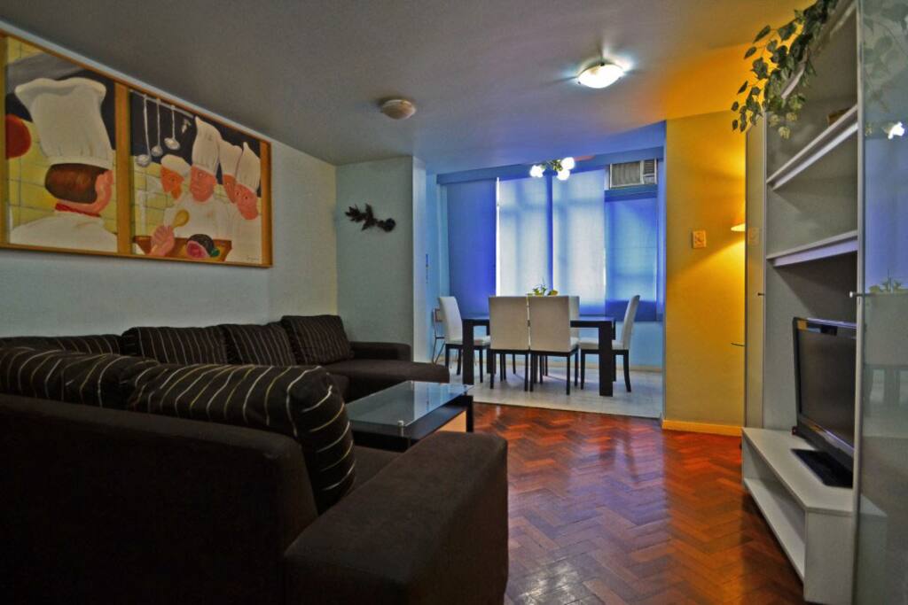 Livingroom with large sofa & dining table.
