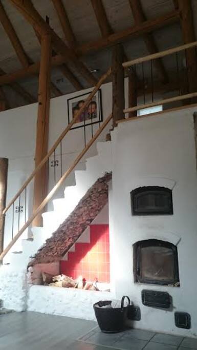 Decorative stone masonry oven with stone stairs.