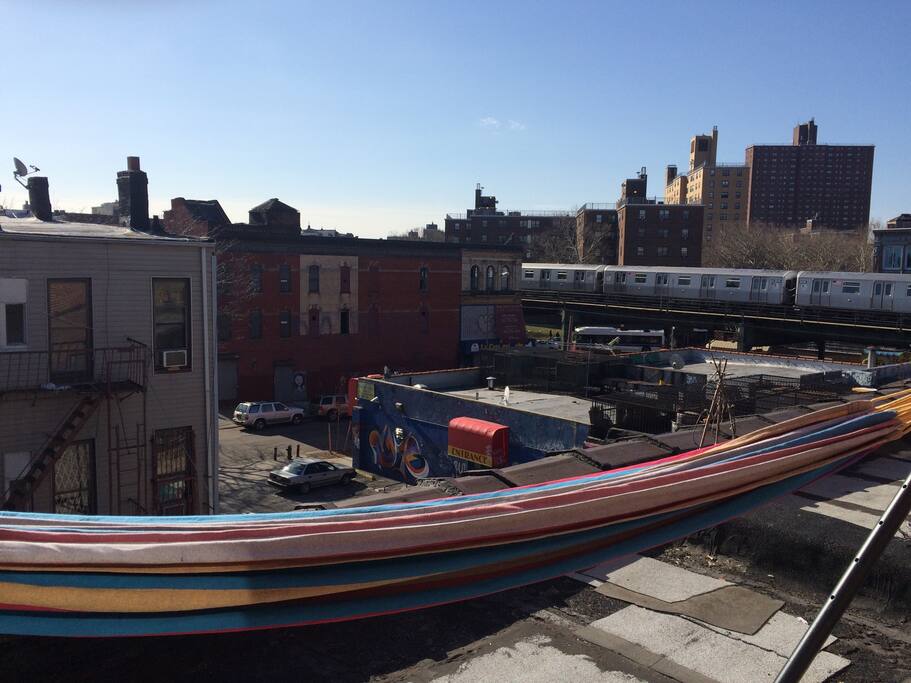 Private roof with hammock. Notice the train very nearby.