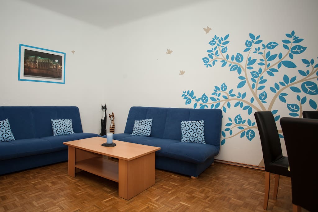 living room with two bed sofas